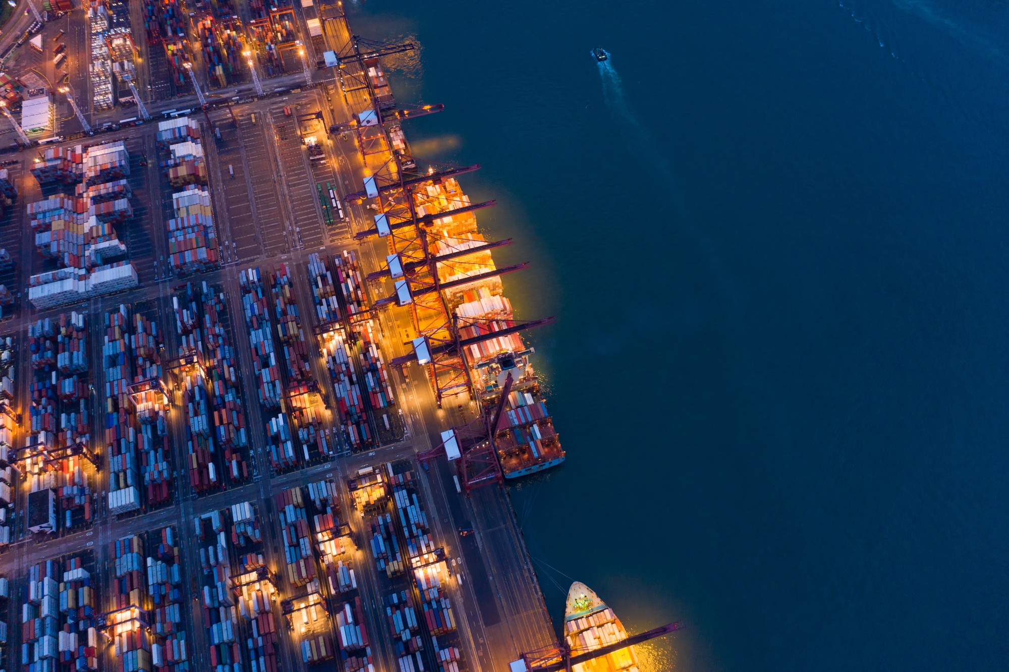 container cargo ship in the export and import business and logistics. Shipping to the harbor