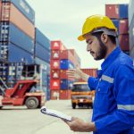 Foremans are discussing for stack container at cargo site logistics service transportation